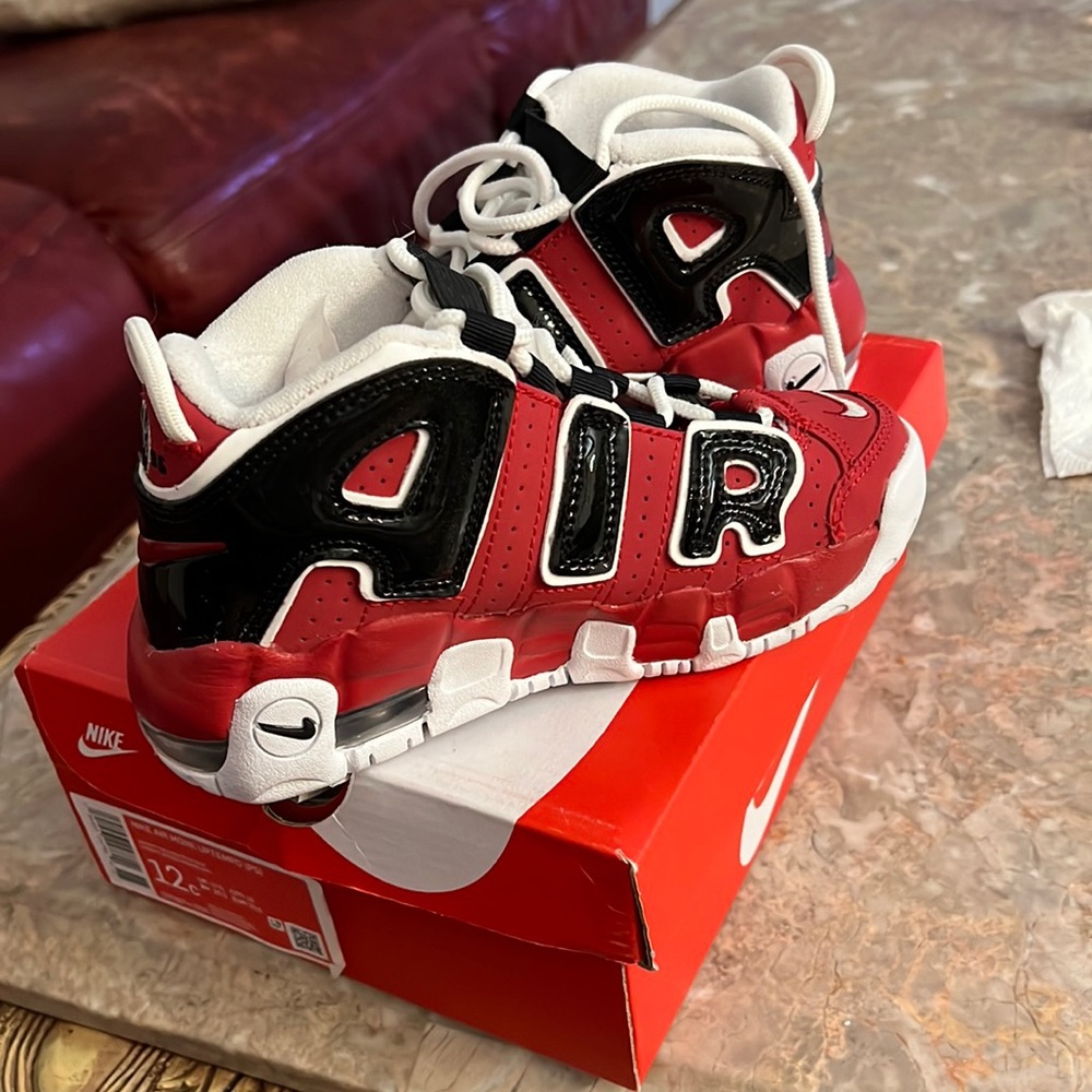 BRAND NEW. NEVER BEEN WORN. Red Nike air uptempo sneakers.